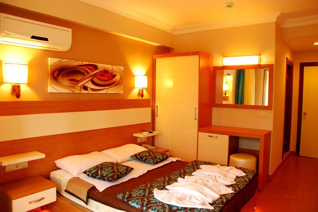 Hotel Flora Suites Soğucak Стая снимка